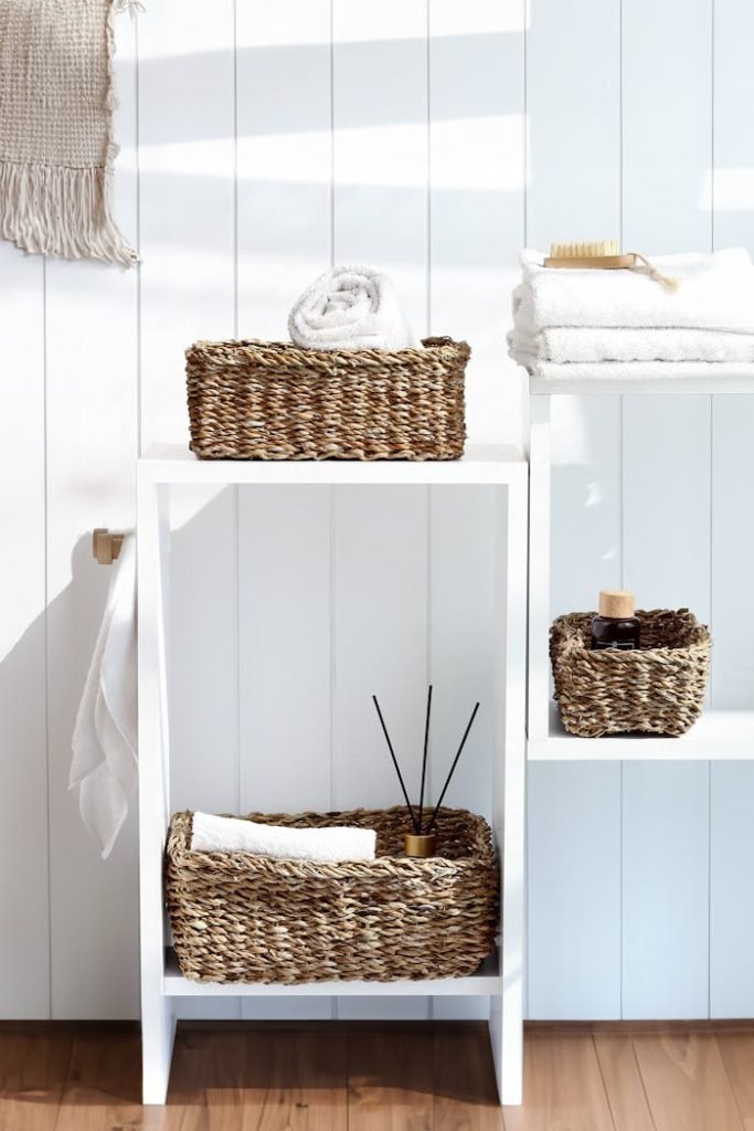 Stylish bathroom storage with wicker baskets on shelves, adding a natural touch to home decor.