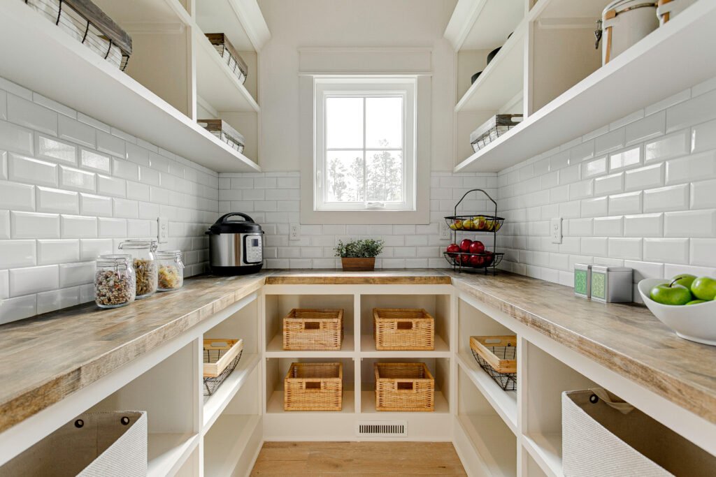 Organized Pantry With Wooden Shelves And Storage Baskets For Easy Access